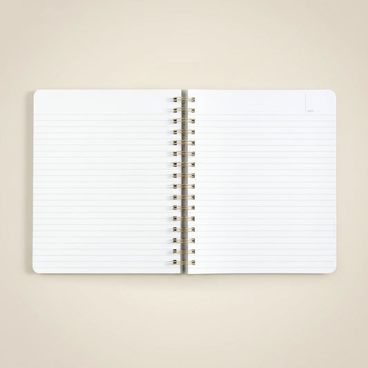 Open notebook with spiral binding on a white background