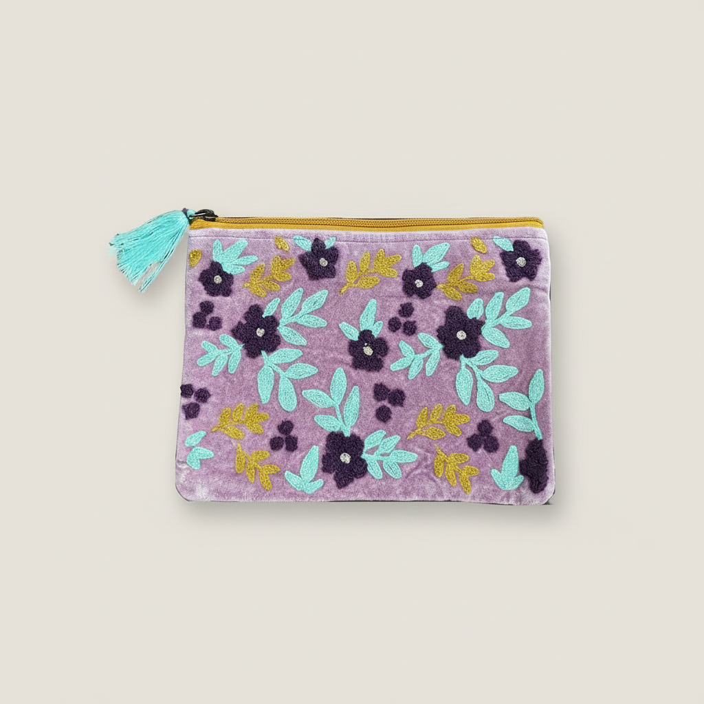Floral-patterned pouch with a tassel on a white background