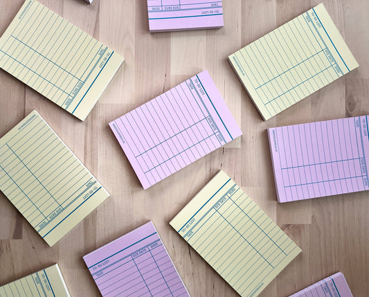 Library card memo pads in yellow and pink colors