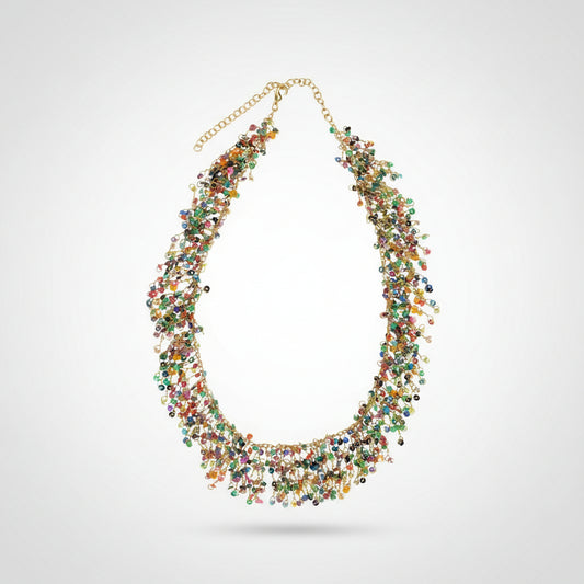 Multicolor sequin beaded necklace with gold metal rings and twisted metal on a white background