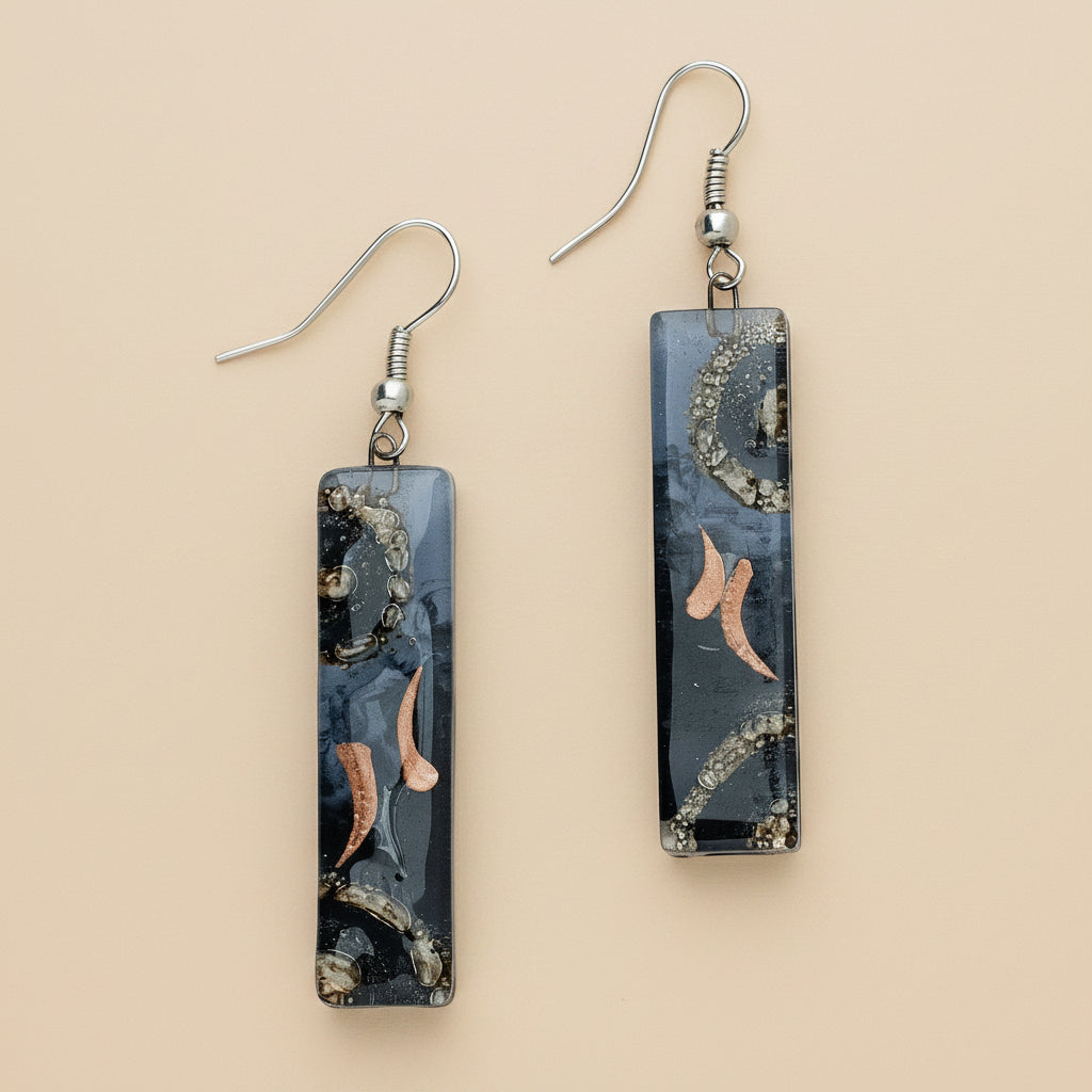 Fused glass earrings with iridescent colors and clean rectangular shape, handmade in Chile.