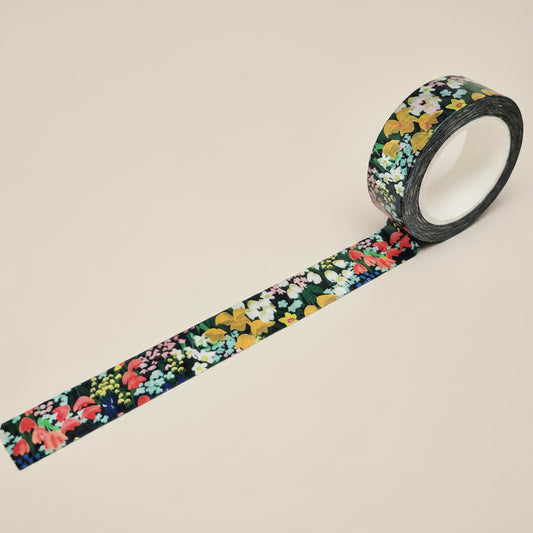 Roll of Meadow inspired washi tape with vibrant colors and flower embellishments