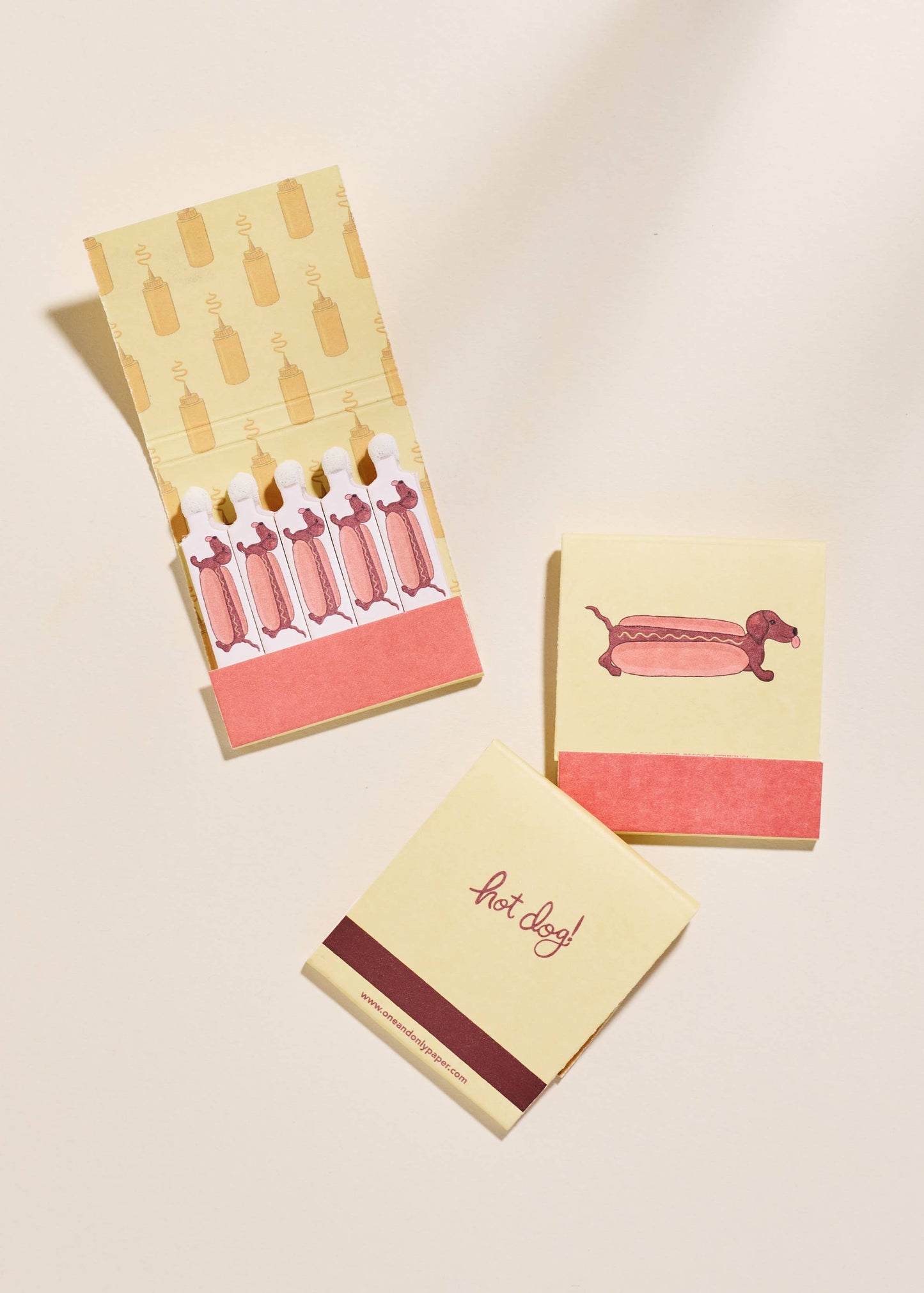 A close up of adorable dachshund design on the "Wiener Dog Matches" open and closed.