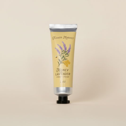 Hand cream tube labeled 'Flower Market Honey Lavender' on a white background