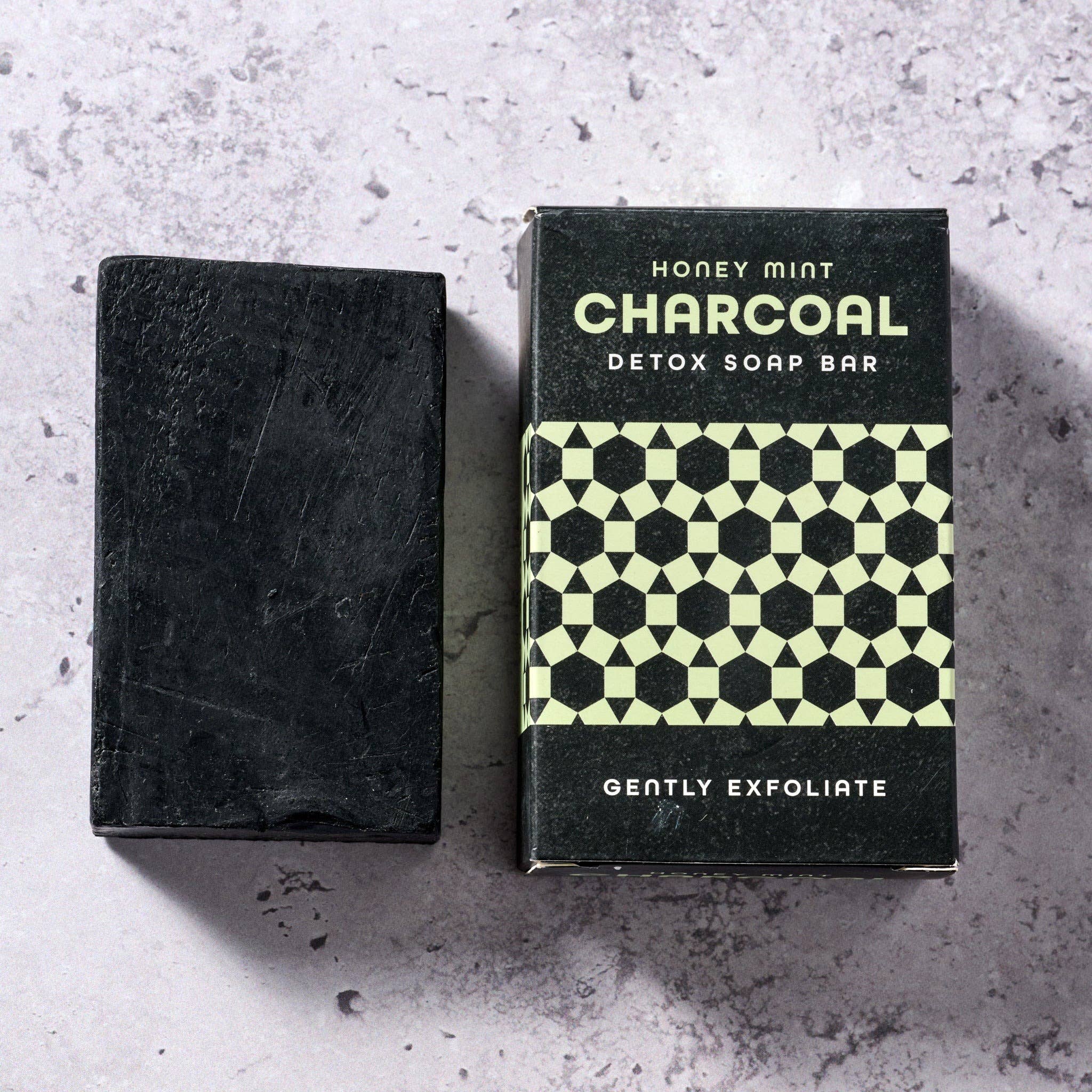 Lavender Charcoal Soap bar with moody black tones and natural styling