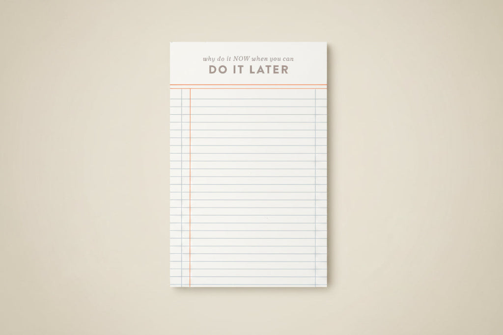 Notepad with lined pages and motivational text on a white background