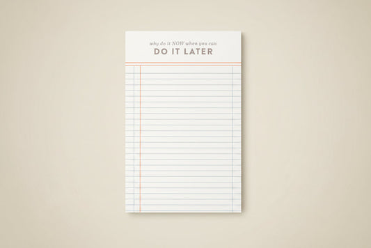 Notepad with lined pages and motivational text on a white background