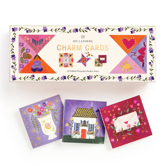 Box of Joy Lafonè charm cards with colorful designs on a white background