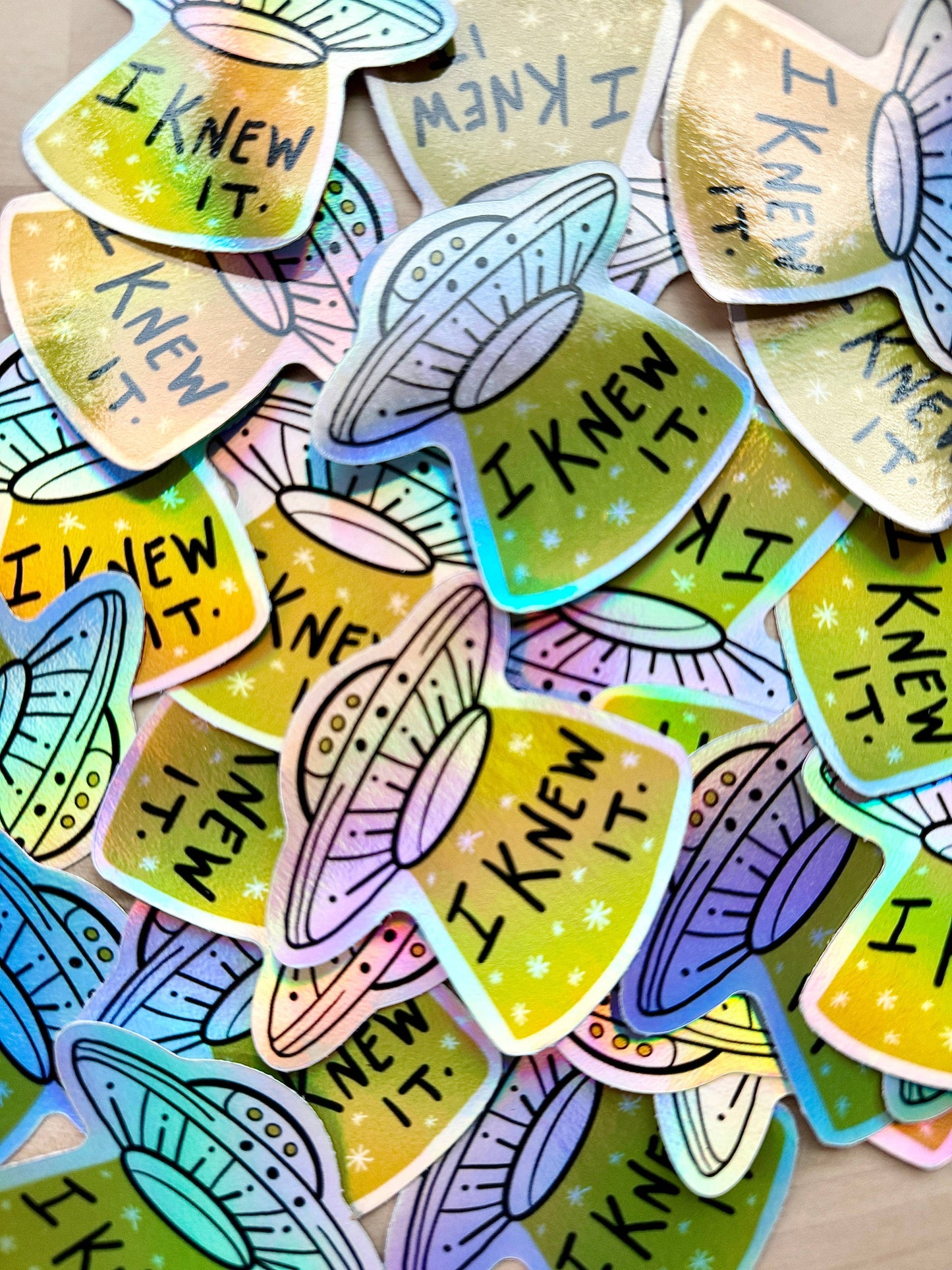 Pile of "I Knew It" UFO sticker for alien enthusiasts and conspiracy theorists