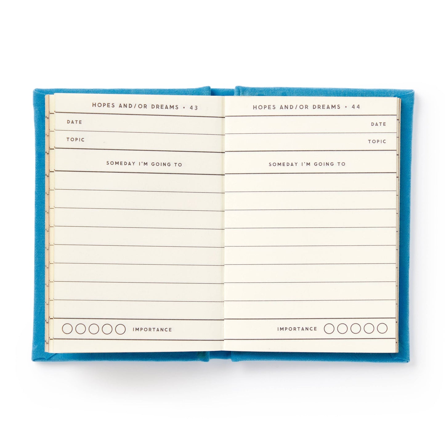 Open notebook with blue cover on a white background