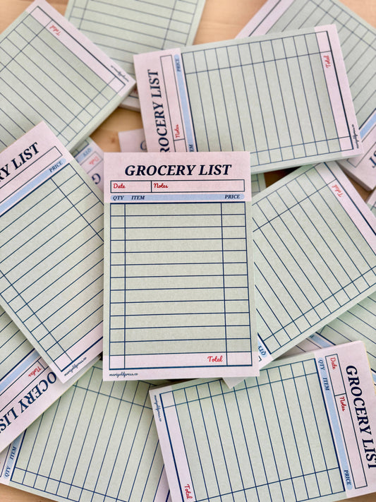 Pile of retro-inspired guest check notepad for organized grocery lists