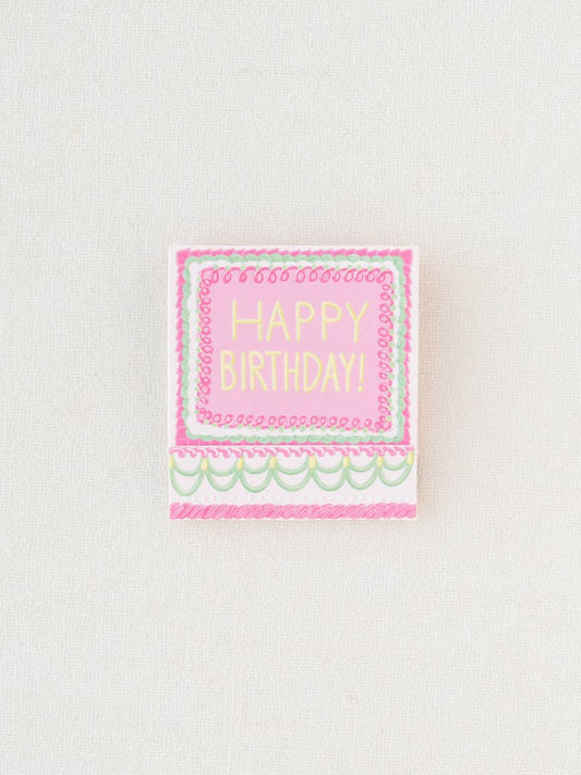 Close up of the matchbook closed, showing the front that says, "Happy Birthday".