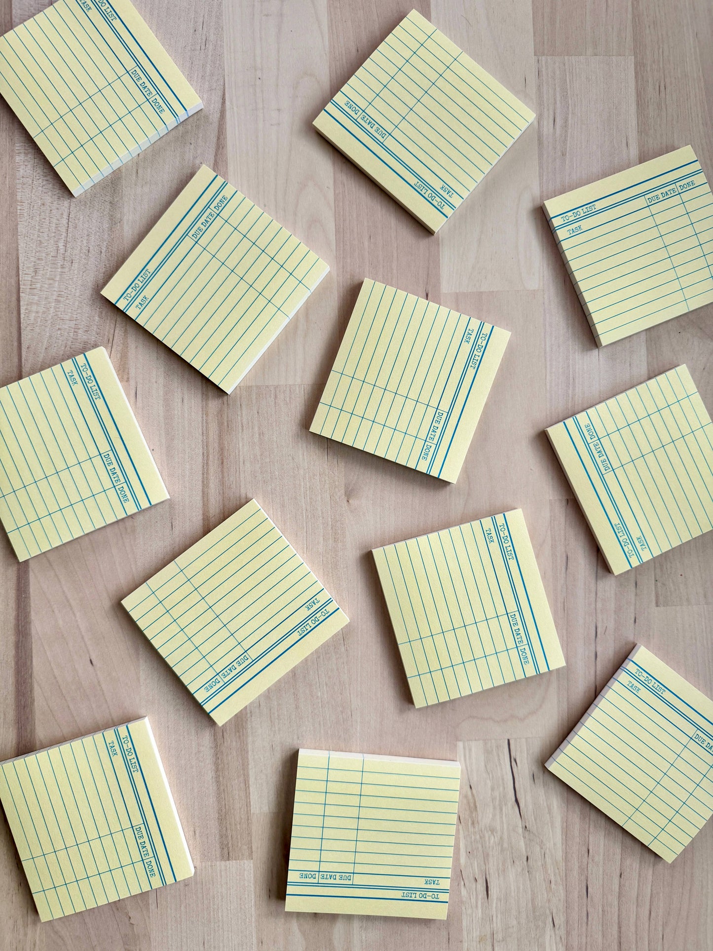 Vintage library card Post-It notes styled on a wooden desk