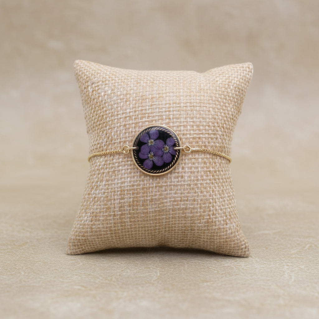 Bracelet with floral design on a textured beige surface