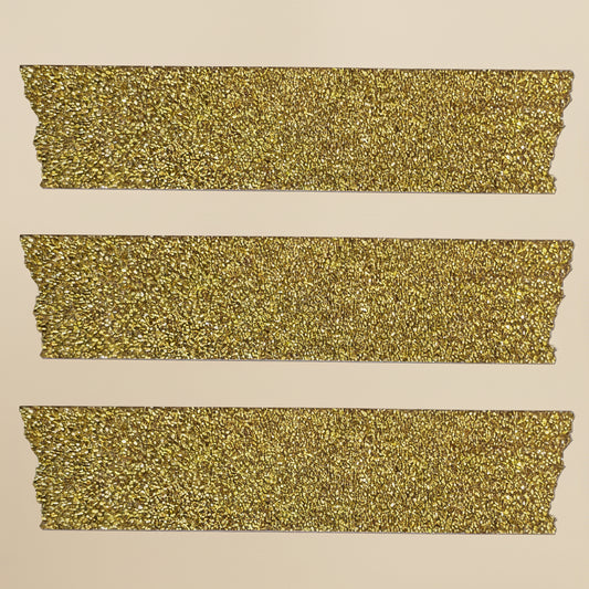 Three strips of the glittery gold washi craft tape on a white background
