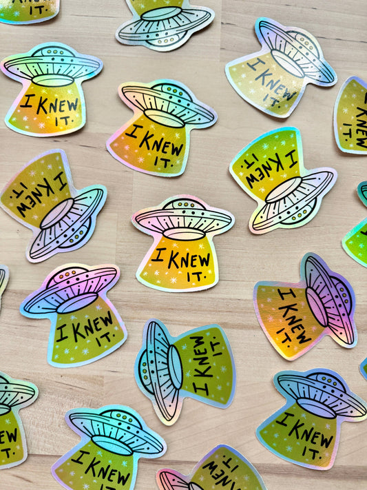 UFO vinyl sticker with 'I Knew It' text on starry background
