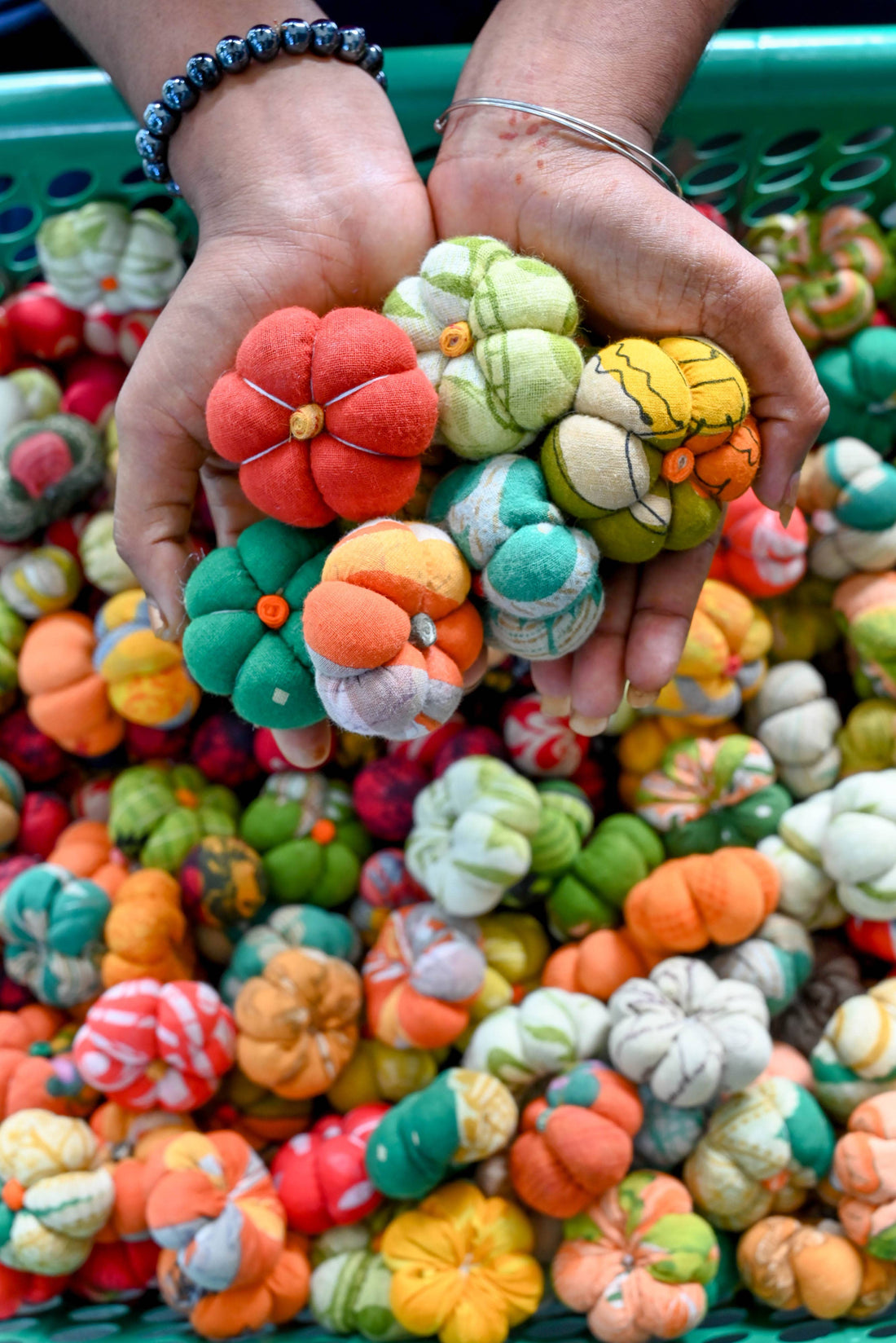 Brightly colored image of pumpkins created from recycled sari material making this a beautiful fair-trade art piece to add to your Fall collection