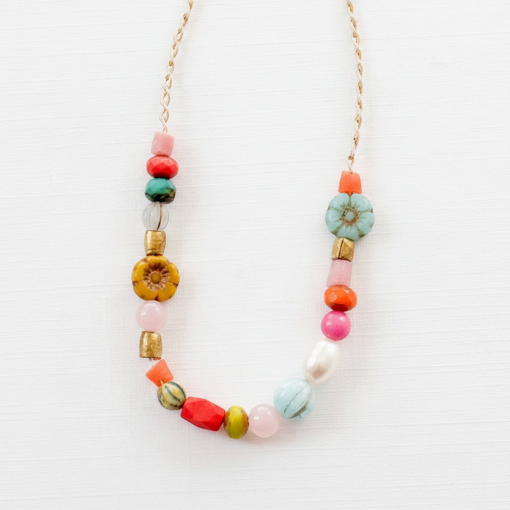 Close-up of pink and coral flower version with recycled beads