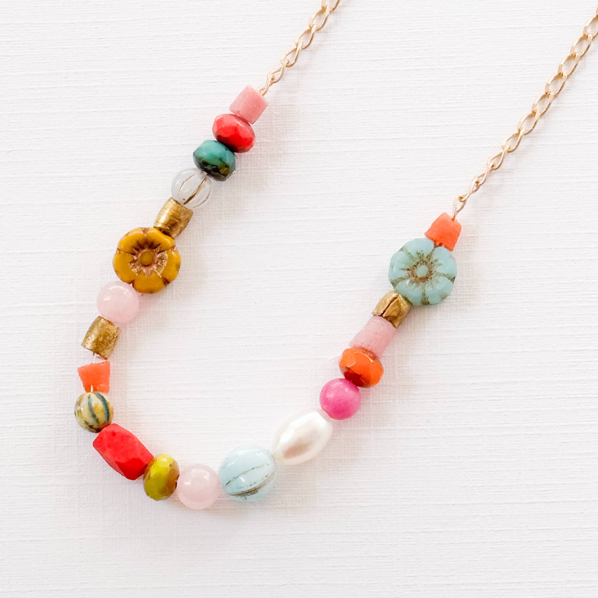 Close-up of pink and coral flower version with recycled beads