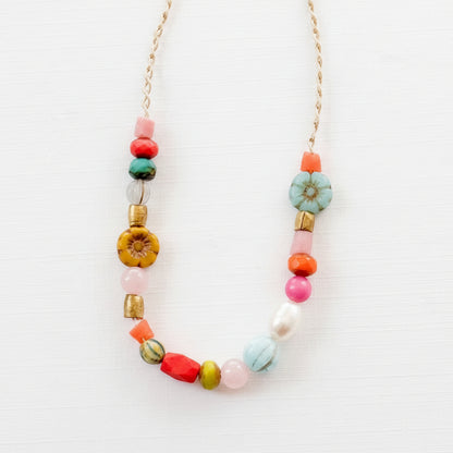 Close-up of pink and coral flower version with recycled beads