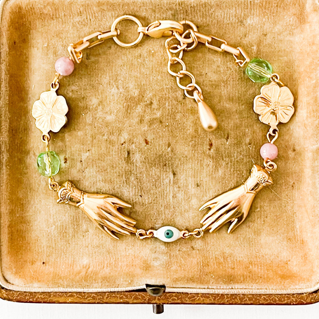 Handmade jewelry flat lay with springtime accessories and floral props
