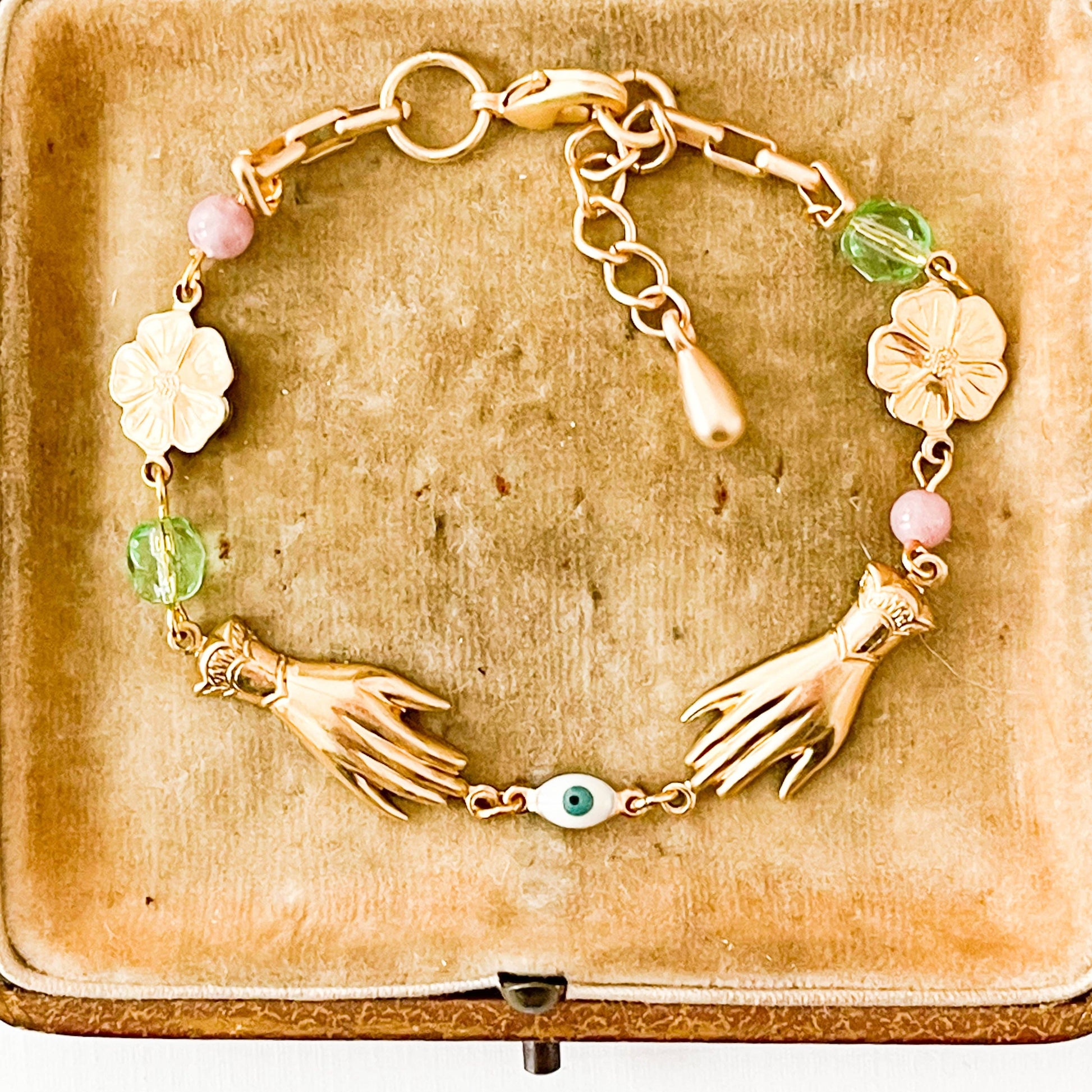 Handmade jewelry flat lay with springtime accessories and floral props