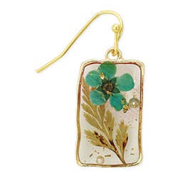 Close-up of botanical turquoise and green leaf details embedded in resin