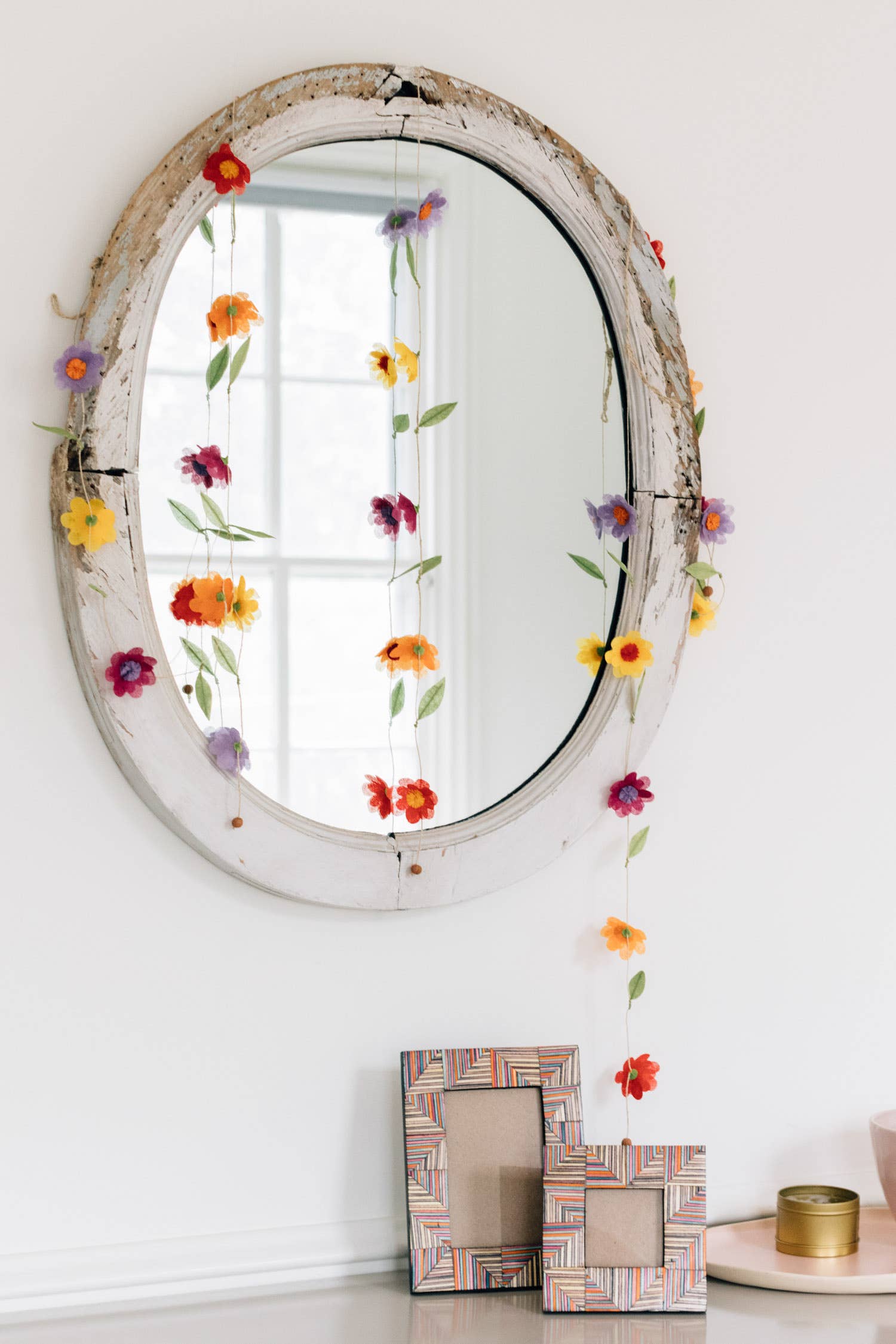 Valance styled above a mirror in an entryway or hallway