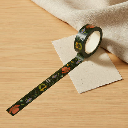 Decorative Art Nouveau tape from Rochambeau Home, with floral patterns on a table top with handmade paper and textiles.