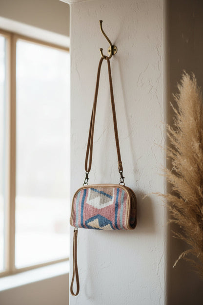 Small handbag with a patterned design on a white background