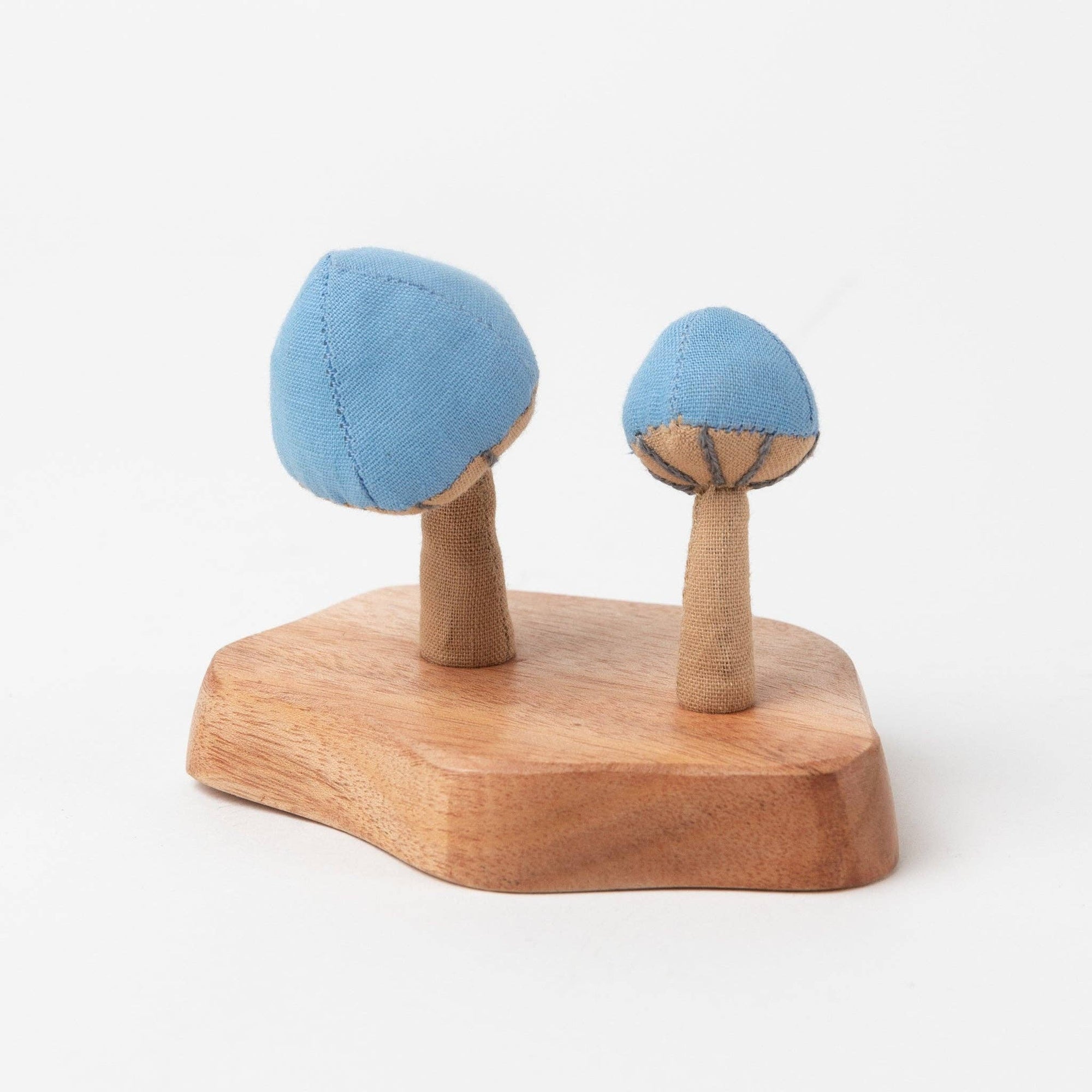 Close-up of handmade mushroom details with natural fabric texture