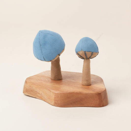 Close-up of handmade mushroom details with natural fabric texture