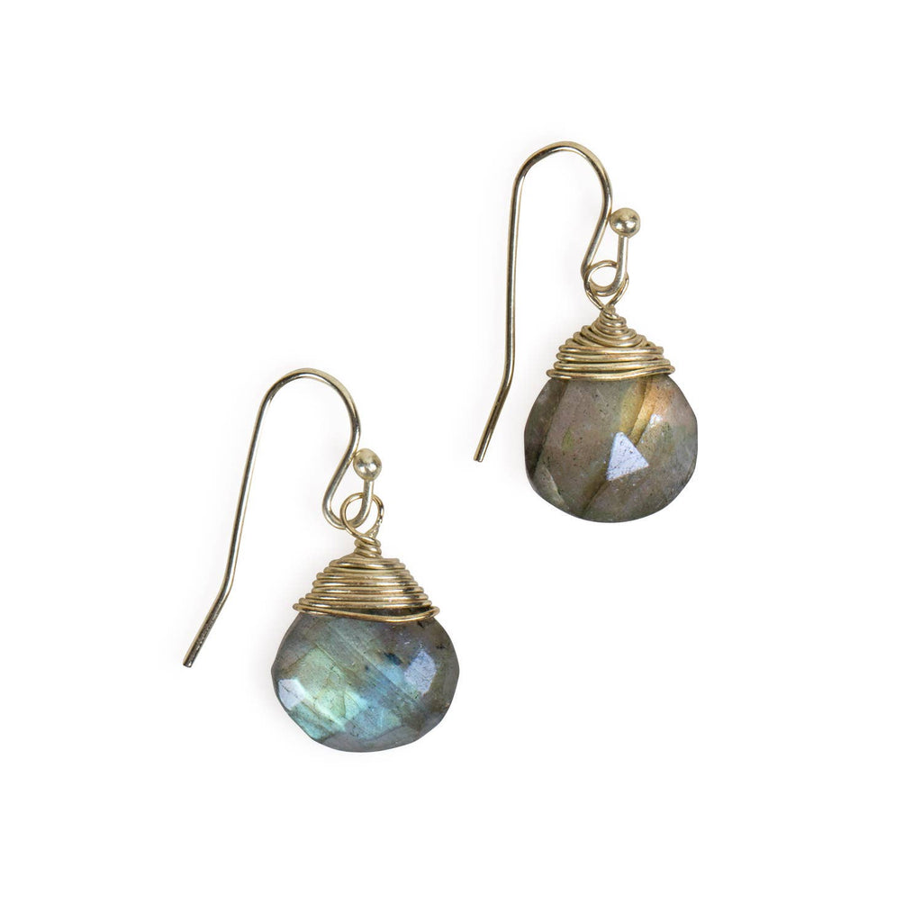 Handmade labradorite earrings displayed on neutral fabric background