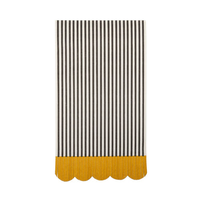 Close up of the black and cream striped dinner napkins with fringe and scalloped edges