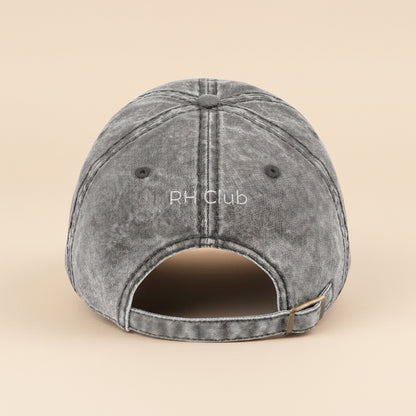 Gray cap with 'RH Club' branding on a white background
