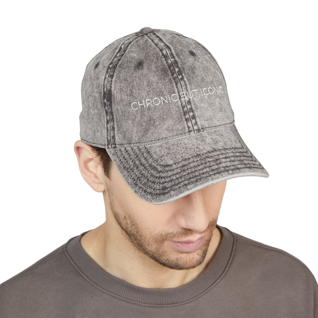 Man wearing a gray denim cap with "Chronic But Iconic" embossed on a white background