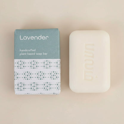 Lavender handcrafted plant-based soap bar with packaging on a white background