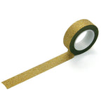 Roll of gold glitter tape on a white background