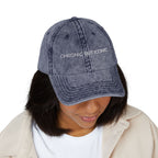 Person wearing a denim cap with 'Chronic But Iconic' text on a white background
