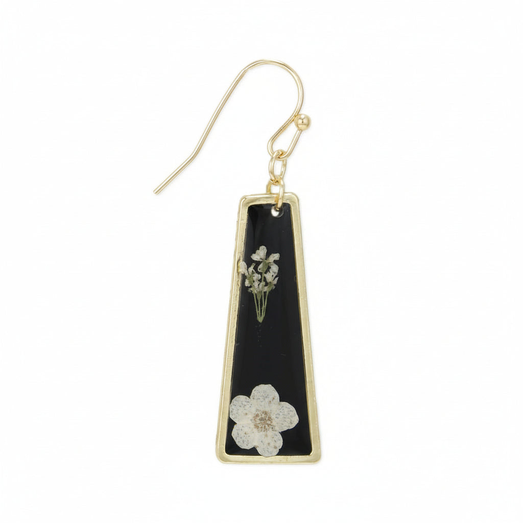 Gold earring with black triangle pendant featuring floral designs on a white background
