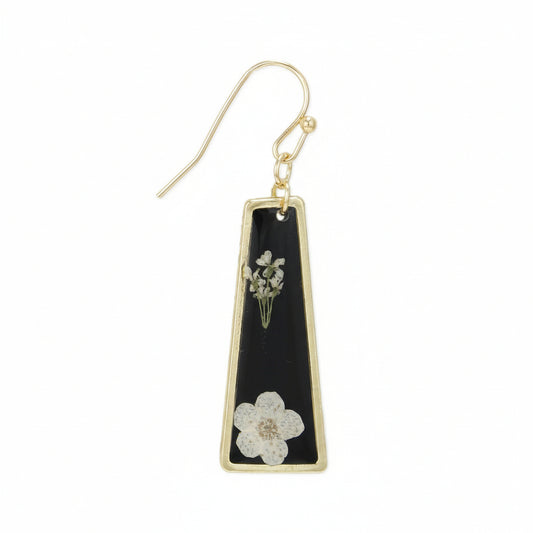 Gold earring with black triangle pendant featuring floral designs on a white background