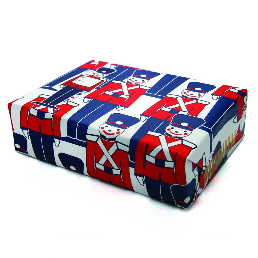 Rectangular box with a festive design featuring soldiers in red, blue, and white on a white background.