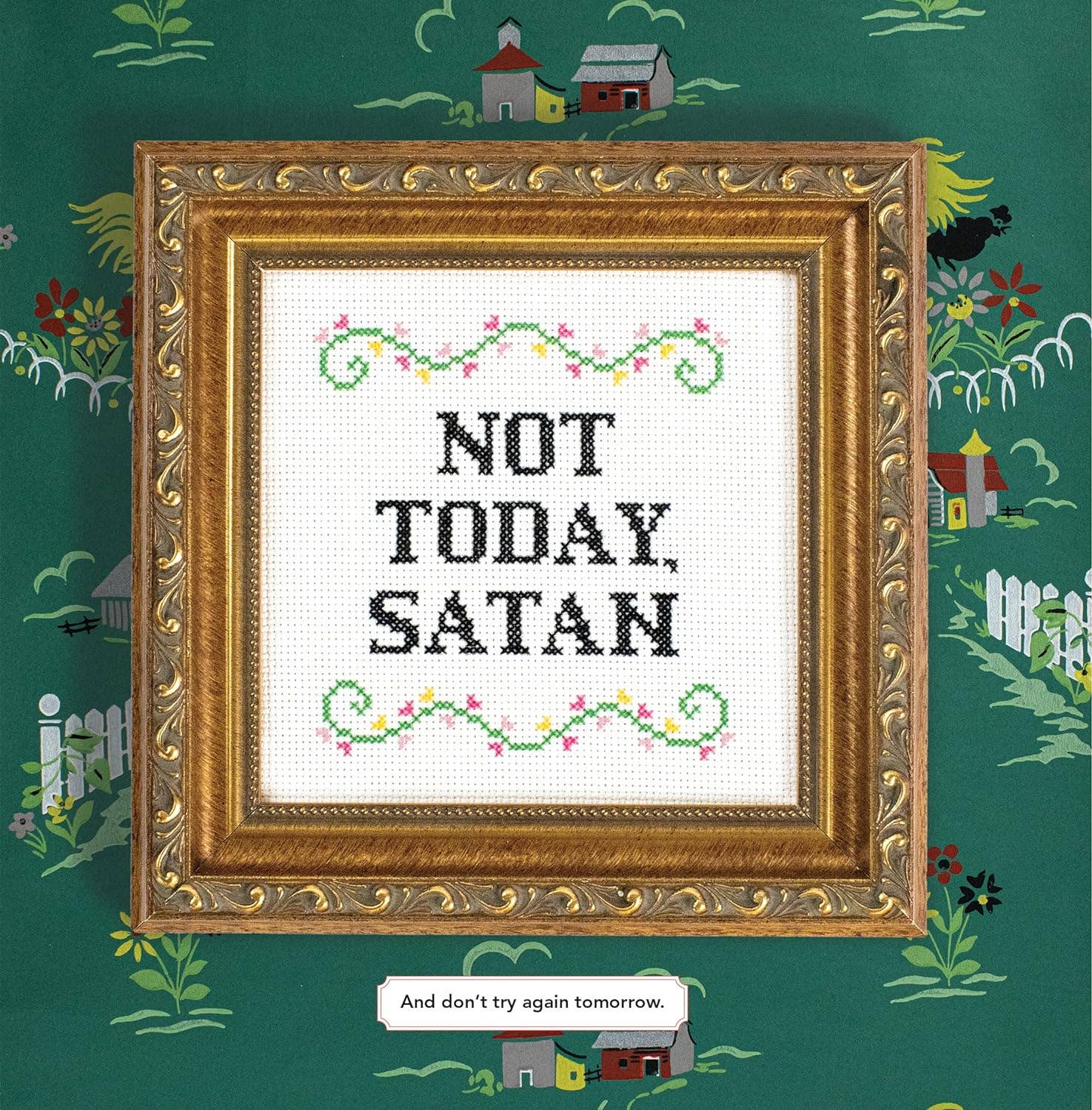Framed cross-stitched art with 'Not Today, Satan' text on a decorative background
