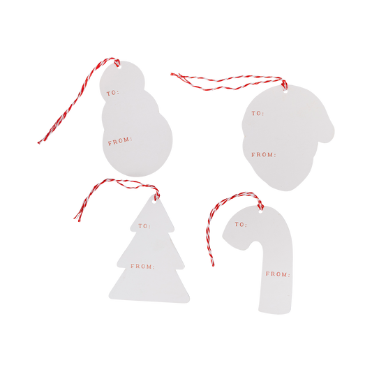 Set of four white Christmas-themed gift tags with 'TO' and 'FROM' text on a white background.