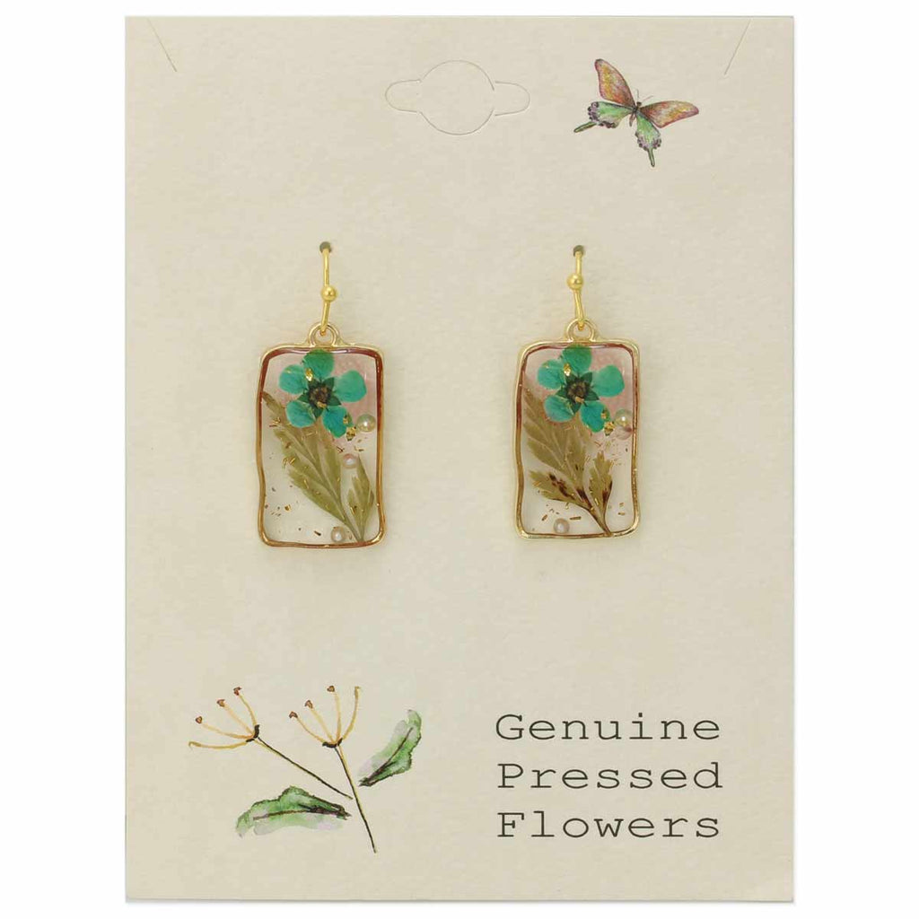 Cottagecore earrings styled with a linen top and soft lighting