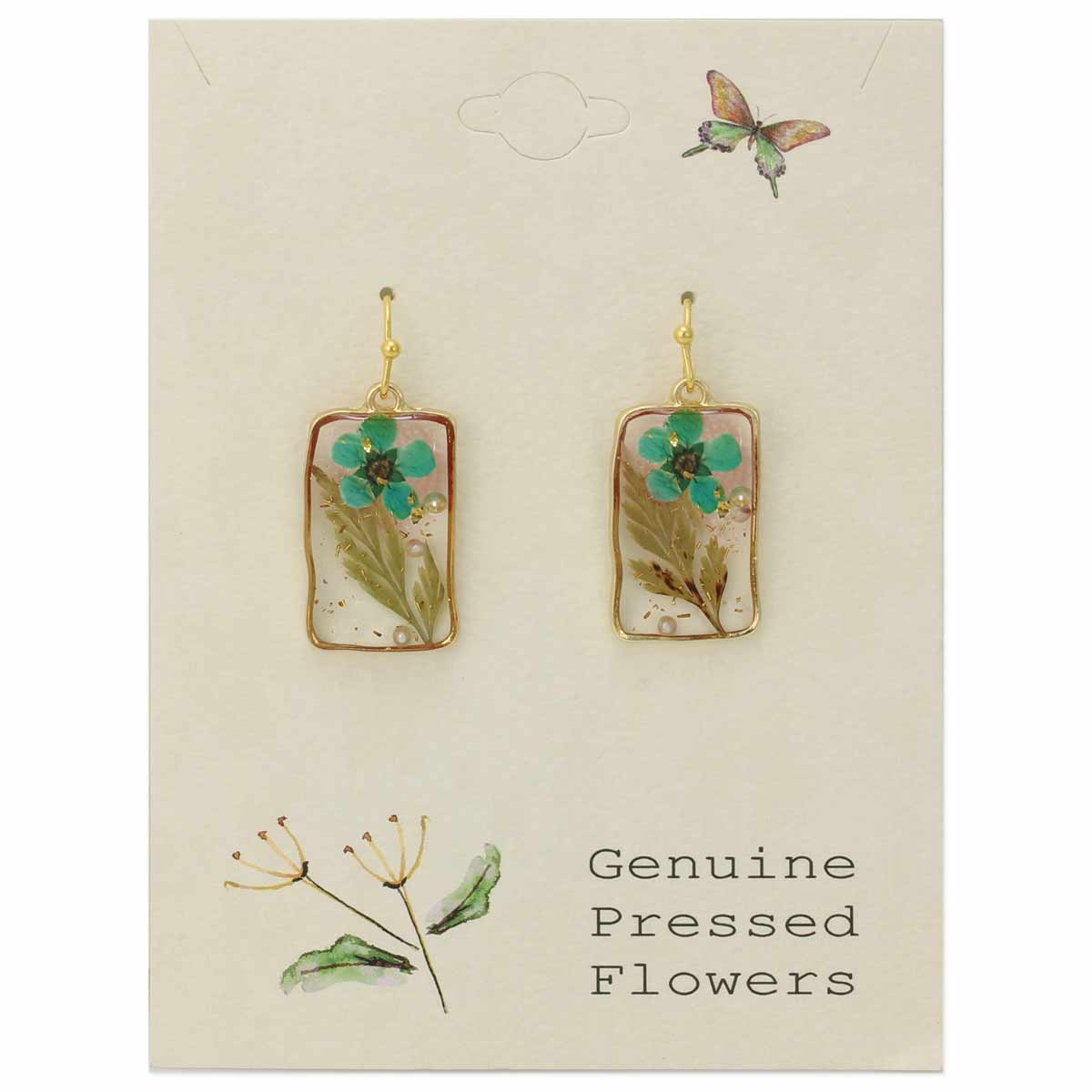 Cottagecore earrings styled with a linen top and soft lighting