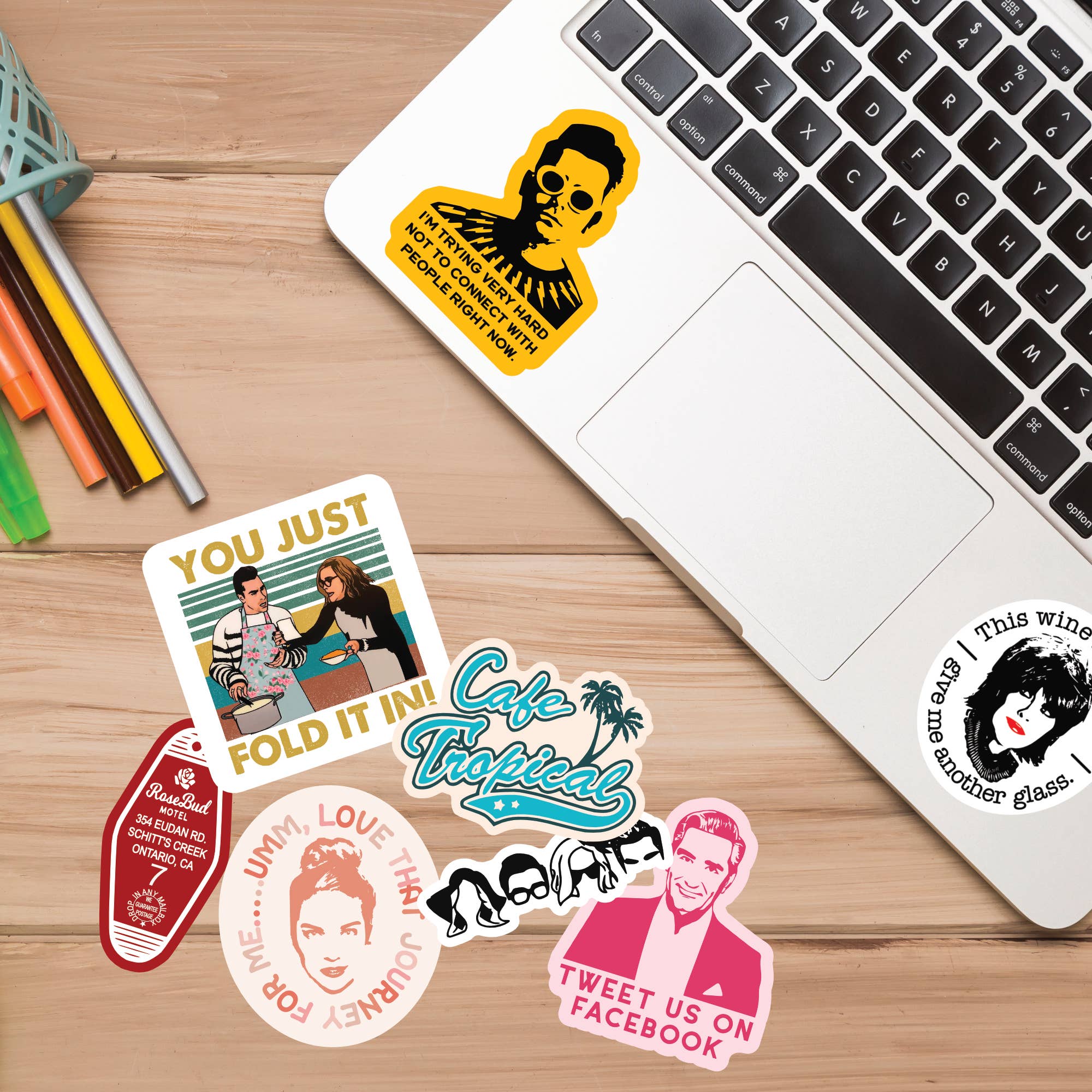 "You Just Fold It In!" Vinyl Sticker - Schitt's Creek Quote on desk.