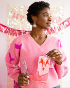 Showing off Pink boot-shaped dinner napkins with gold foil accents