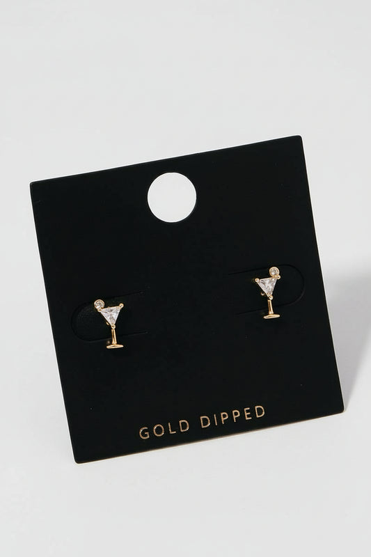 A pair of gold-dipped stud earrings in the shape of a martini glass with a cubic zirconia sparkle, displayed on a black backing card.