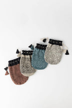 Collection of assorted fabric gift bags in colorful prints with drawstring closures